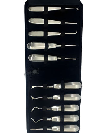 Set of metal tools in a black case on a white background